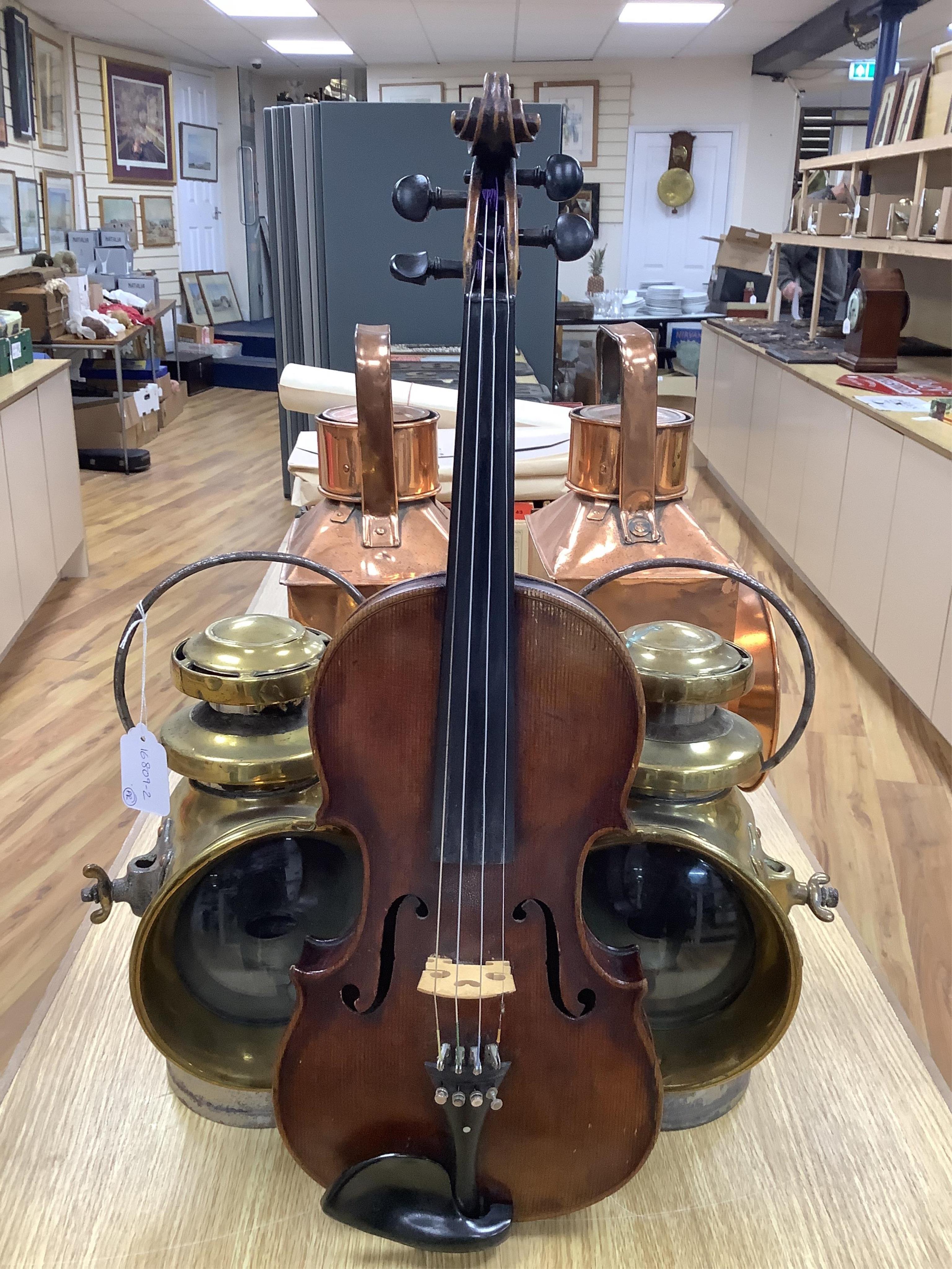 A cased 19th century English violin, with label reading George Craske, Fecit 1842, Edward Crompton, 54, Barton Arcade, Deansgate, Manchester, body length 36cm. Condition - fair to good.